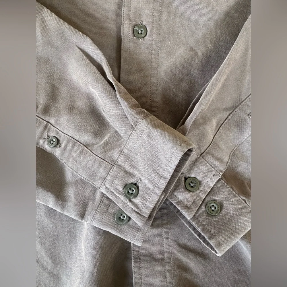 The NorthFace Gray button down shirt. Men’s Large